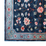 Beautiful Peony Garden Hand Tufted Wool Area Rug featuring a vibrant floral pattern with pink and red blossoms on a rich blue background. Ideal for adding elegance to large living room spaces, this wool rug combines style and comfort effortlessly.