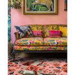 Stylish living room featuring a Peony Meadow Hand Tufted Area Rug with vibrant floral designs. The wool rug complements the colorful sofa and artwork, creating a lively and inviting space. Ideal for living room rugs 8x10.