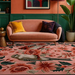 A vibrant living room featuring a Peony Meadow hand-tufted area rug with a stunning floral design. The 8x10 wool rug enhances the space with its rich colors and intricate patterns, perfectly complementing the peach sofa and green accents.