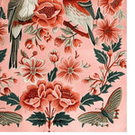 A detailed view of the Peony Meadow Hand Tufted Area Rug showcasing its vibrant floral design. This wool rug features an intricate pattern of pink and red flowers with lush green leaves, perfect for adding a touch of elegance to living room rugs 8x10.