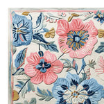 Vibrant area rug featuring a hand-tufted floral design with pink and blue blossoms, perfect as a wool rug for living room spaces. This 8x10 rug brings a touch of meadow-inspired elegance to any home decor.