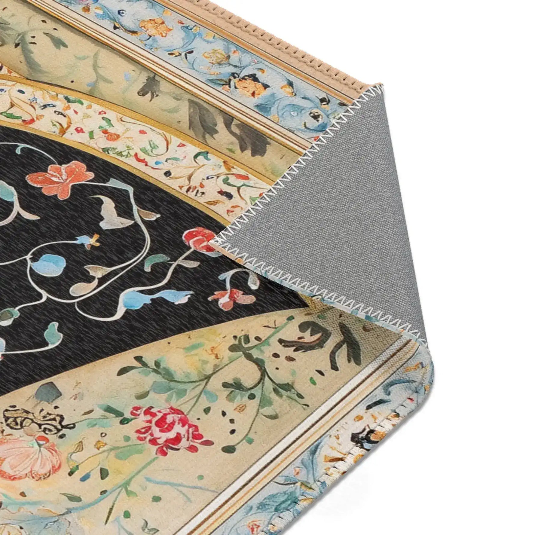 Persian Beauty Hand-Painted Floral Art Rug corner fold showing black floral center, gold-cream arch border, blue outer edge, grey back