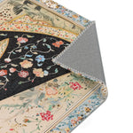 Persian Beauty Hand-Painted Floral Art Rug corner fold showing floral black robe detail, cream border, gold line, grey backing