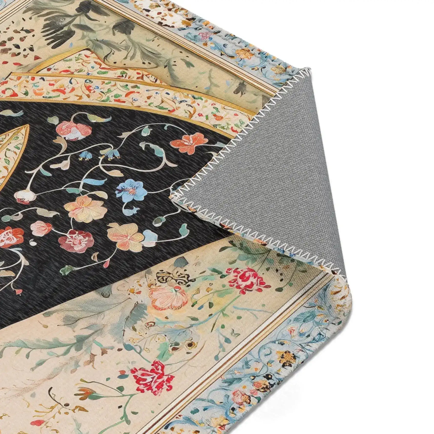 Persian Beauty Hand-Painted Floral Art Rug corner fold showing floral black robe detail, cream border, gold line, grey backing