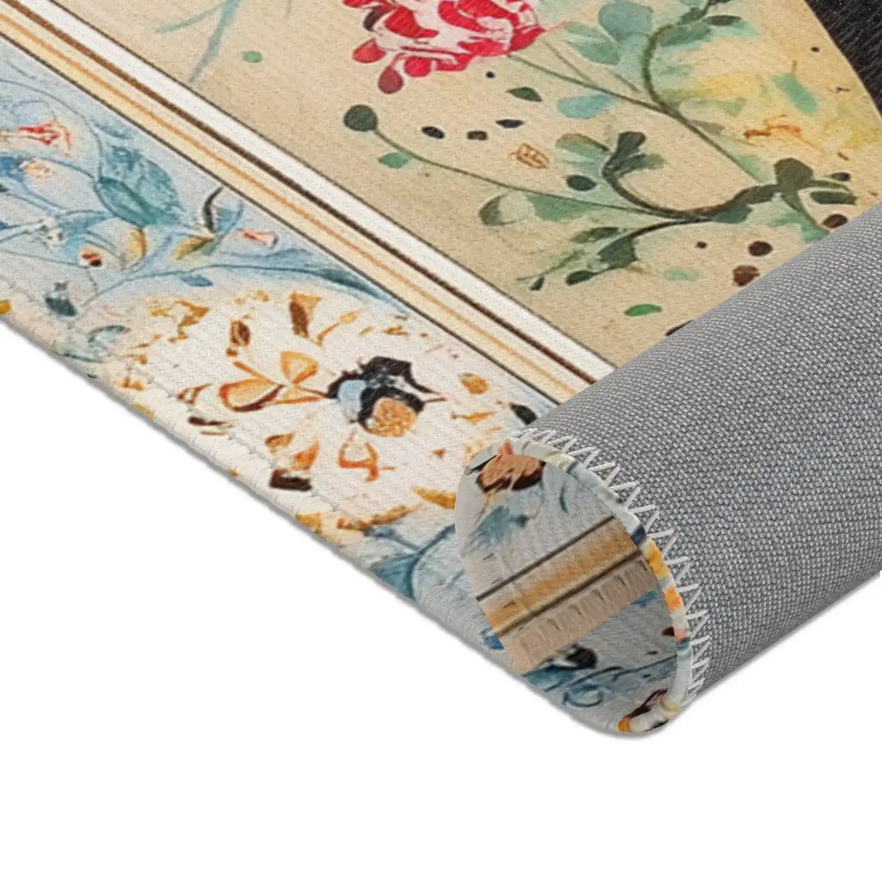 Persian Beauty Hand-Painted Floral Art Rug rolled corner showing blue floral border, cream center with red rose, grey non-slip backing