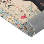 Persian Beauty Hand-Painted Floral Art Rug side fold showing blue floral border, cream field, black vine pattern, grey backing detail