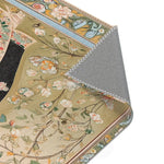Persian Elegance Floral Black Robe Art Rugs folded corner detail showing dark baroque pattern with red and gold accents on grey backing
