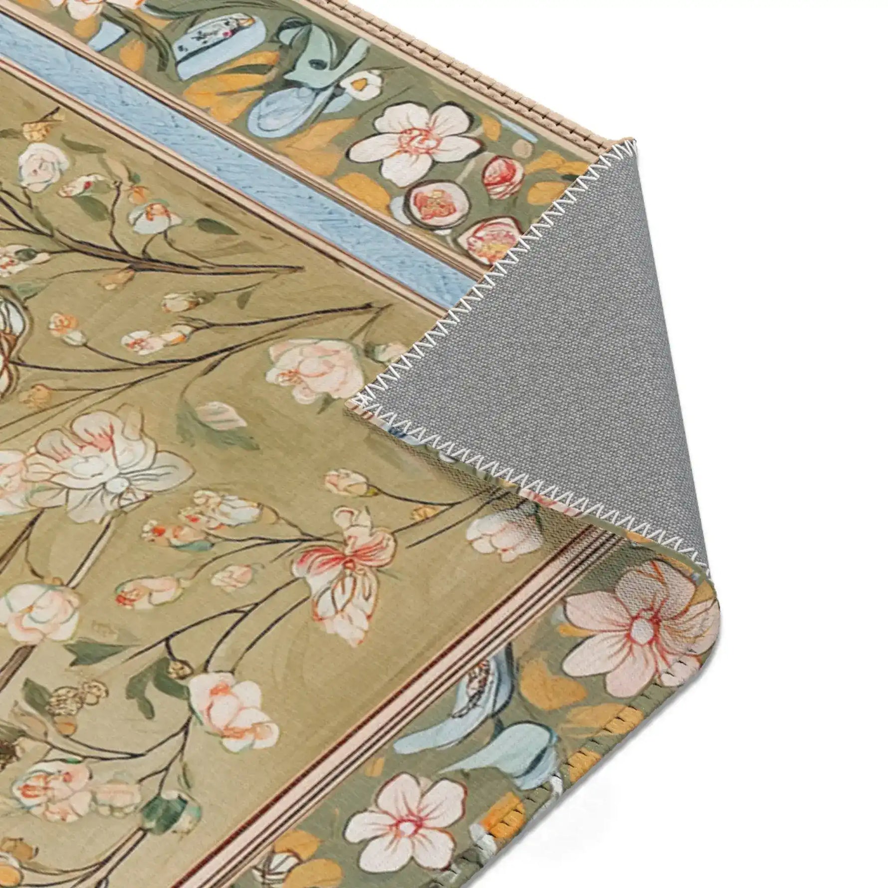 Persian Elegance Floral Black Robe Art Rugs corner fold revealing sage green field with pink orchids and multicolor floral border on grey backing