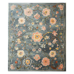 The Persian Floral Harmony Hand Tufted Wool Rug showcases a stunning array of colorful floral patterns set against a soft blue background. This area rug is perfect for adding elegance to living rooms. Its lush wool texture enhances warmth and comfort, making it an ideal floral rug choice for those seeking quality wool rugs for living room spaces.