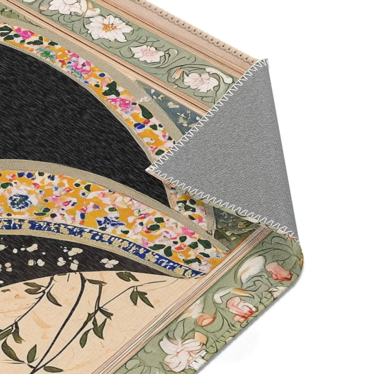 Corner fold of the Persian Hand-Painted Floral Calligraphy Rug revealing grey non-slip back, floral calligraphy border edge in sage green
