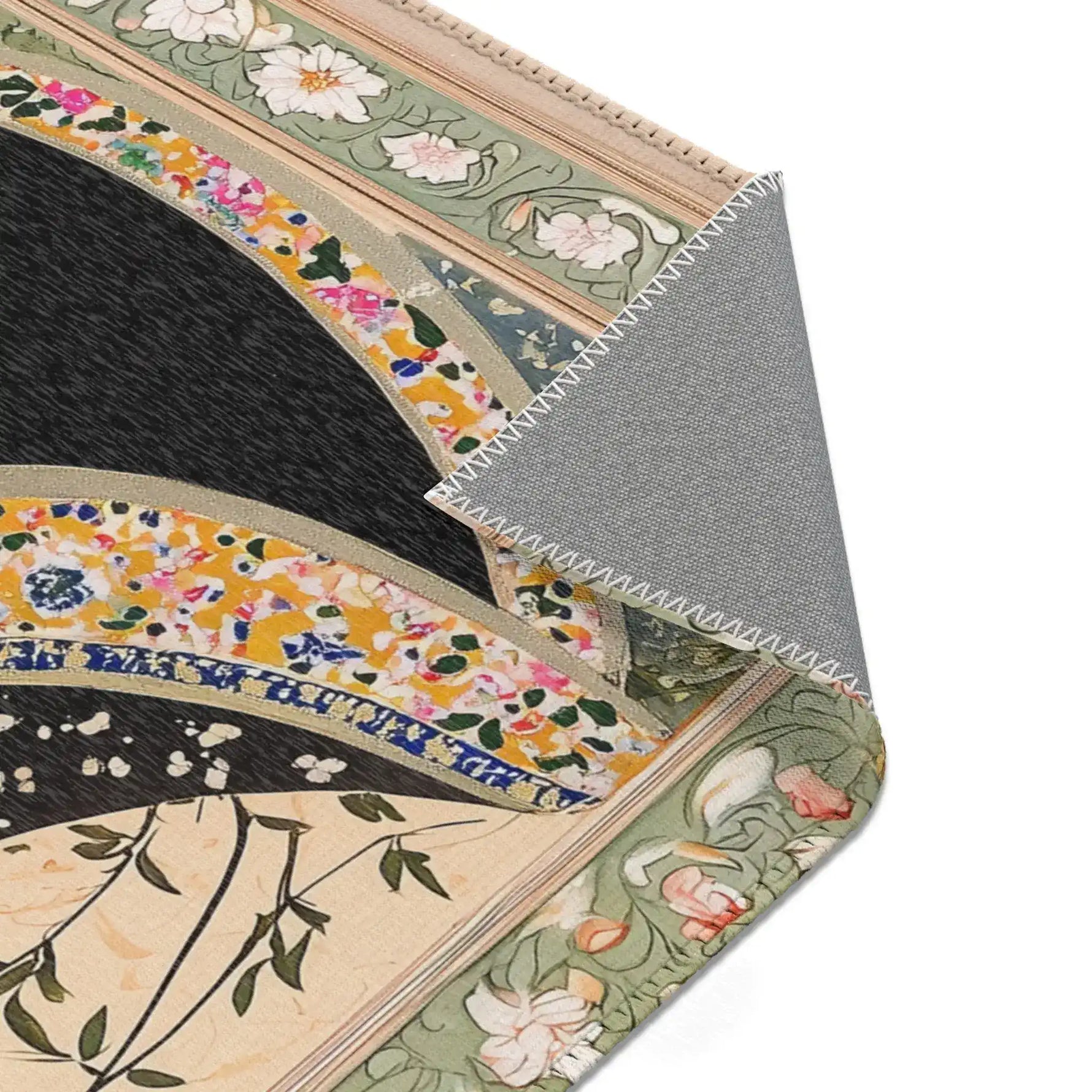 Corner fold of the Persian Hand-Painted Floral Calligraphy Rug revealing grey non-slip back, floral calligraphy border edge in sage green
