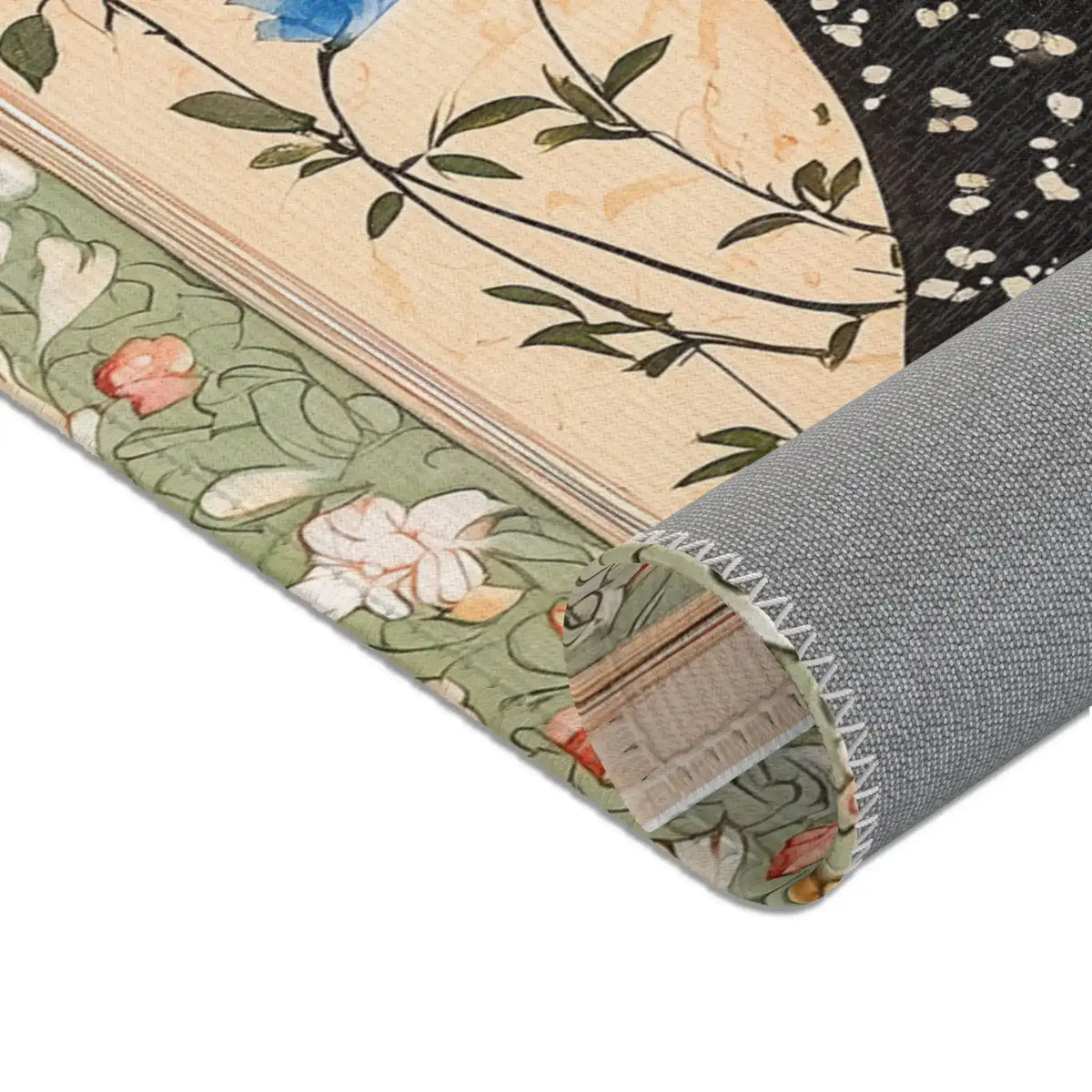 Rolled edge of the Persian Hand-Painted Floral Calligraphy Rug revealing backing, black starry robe field and sage floral border detail