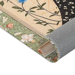 Rolled edge of the Persian Hand-Painted Floral Calligraphy Rug revealing backing, black starry robe field and sage floral border detail