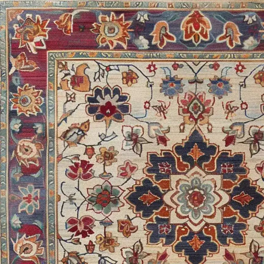 Close-up of a Persian Palette Hand Tufted Rug, showcasing a vibrant floral design. This square area rug features intricate patterns in rich red, blue, and beige tones, ideal for adding a vintage touch to living room decor. Perfect wool rug for those seeking Persian rugs with a classic elegance.