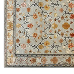A beautifully designed Persian Petals Hand Tufted Wool Rug showcasing an intricate floral pattern in warm tones. This living room area rug is crafted from high-quality wool, making it a perfect floral rug choice for those seeking stylish and durable rugs for the living room.