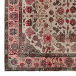 Top view of a Persian Reflection hand-tufted wool rug, showcasing intricate floral and geometric patterns in shades of red, pink, and beige. This elegant area rug is perfect for an 8x10 living room space, adding a touch of classic charm to your home decor.