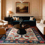 A beautifully designed Petal Cascade Hand Knotted Area Rug in a sophisticated living room setting. The large 8x10 floral rug features vibrant colors and vintage Persian motifs, adding elegance and warmth to the room. Perfect as a centerpiece among large living room rugs.
