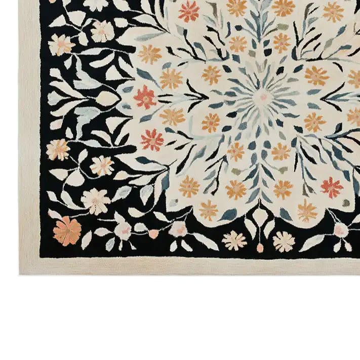 Beautiful Petal Cascade Hand Tufted Wool Rug featuring intricate floral designs in warm tones of orange, red, and blue on a cream background. Perfect for adding elegance to living room area rugs, this 8x10 wool rug combines style and comfort seamlessly.