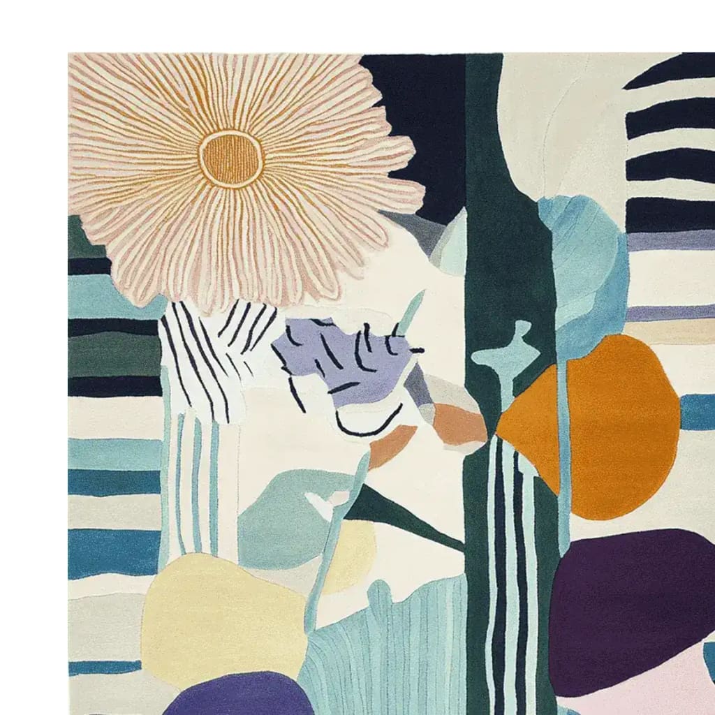 This vibrant area rug, titled 'Petal Chaos Hand Tufted Rug', features a contemporary abstract design with bold florals and geometric patterns. Crafted from wool, this rug is perfect for adding a modern touch to any living room, serving as an eye-catching centerpiece among living room area rugs.