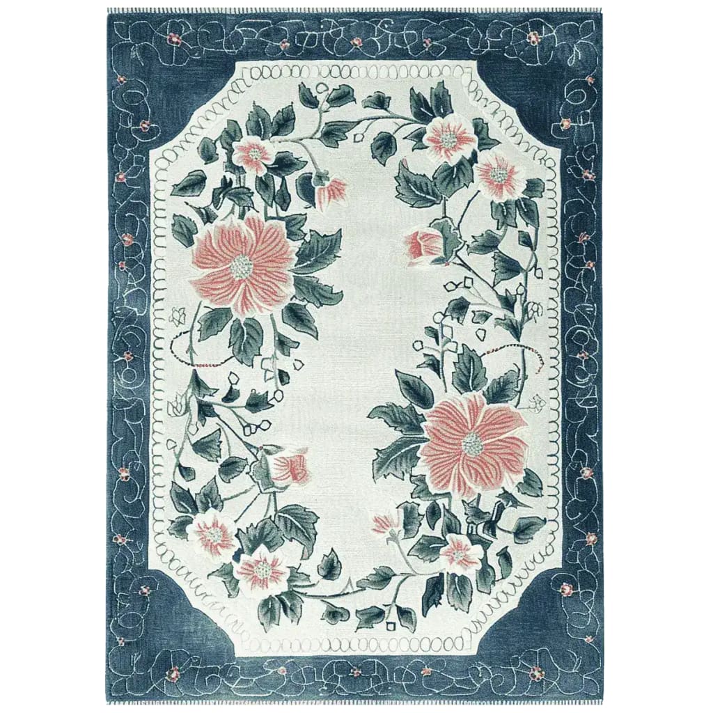 The Petal Crest Bloom Hand Tufted Area Rug features a stunning floral design with large pink flowers and lush green leaves, set against a soft beige background. This elegant wool rug is perfect for adding a touch of nature to your living room area. Its intricate border and detailed pattern make it a standout piece among rugs for living rooms.