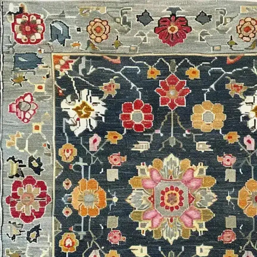 Close-up of the Petal Illusion Hand Knotted Area Rug showcasing a vintage Persian-inspired floral design. The intricate pattern features vibrant red, orange, and pink flowers on a dark background, perfect for adding elegance to living room rugs 8x10.