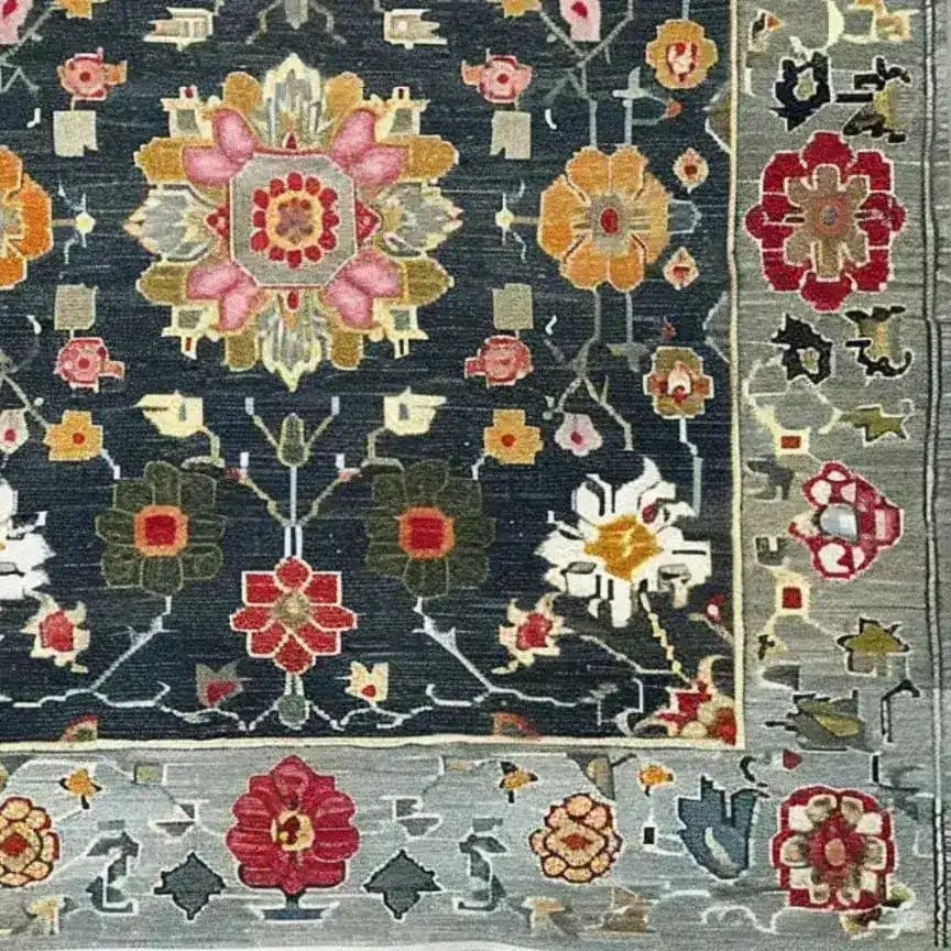 Close-up of the Petal Illusion Hand Knotted Area Rug, showcasing its intricate floral design in vibrant colors like pink, orange, and red. This elegant piece is perfect for adding a touch of vintage charm to living room rugs 8x10, ideal as a floral rug or Persian-style decor.