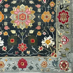 Close-up of the Petal Illusion Hand Knotted Area Rug, showcasing its intricate floral design in vibrant colors like pink, orange, and red. This elegant piece is perfect for adding a touch of vintage charm to living room rugs 8x10, ideal as a floral rug or Persian-style decor.