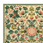 This image showcases a detailed corner of the Petal Medallion Echo Hand Tufted Area Rug, featuring an intricate floral design in lush greens, pinks, and hints of gold. Perfect as a square area rug, this large living room rug adds a touch of elegance with its wool composition, making it a standout piece among floral rugs for living rooms.