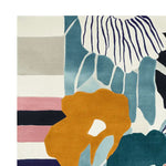Vibrant contemporary area rug with a hand-tufted abstract floral design in shades of blue, orange, and pink. This wool rug adds a splash of color to large living rooms, perfectly sized at 8x10 for a modern touch.