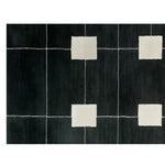 A contemporary hand tufted wool runner rug featuring a geometric pattern with white squares on a dark background. Ideal for use as a hallway runner rug, kitchen rug, or bathroom runner rug, this elegant and modern wool rug adds a touch of sophistication to any space.