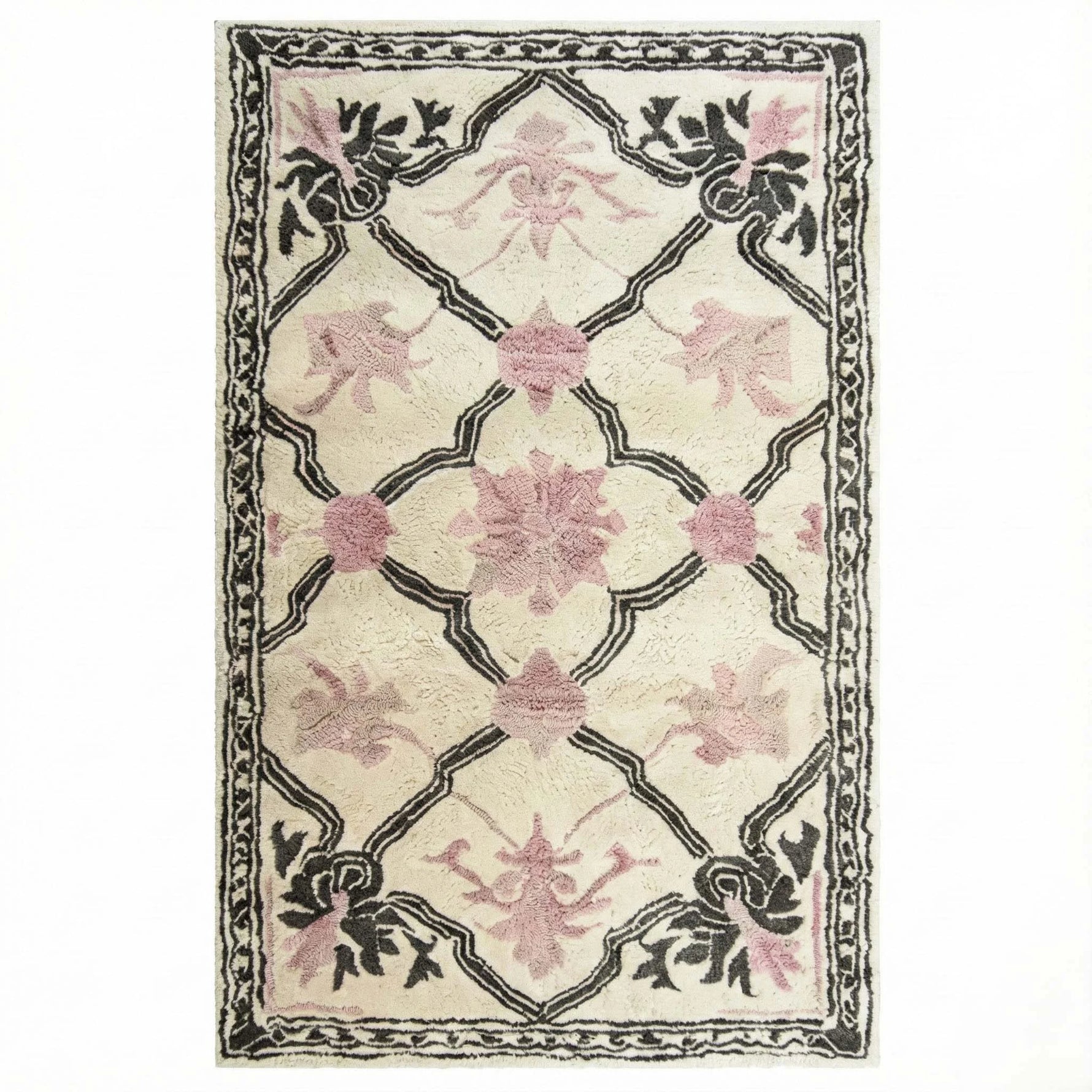 Elegant Petal Veil Mosaic Hand Tufted Area Rug, perfect for adding a vintage touch to your living room or dining room. The design features delicate pink floral patterns with intricate black detailing on a cream background, ideal for living room rugs 8x10 or as a wool rug centerpiece.