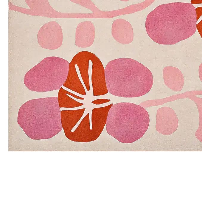A vibrant, contemporary wool area rug featuring an abstract design with bold pink and orange petal shapes, perfect for adding a modern touch to a living room. This hand-tufted wool rug offers a unique aesthetic for large living room spaces.