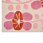A vibrant, contemporary wool area rug featuring an abstract design with bold pink and orange petal shapes, perfect for adding a modern touch to a living room. This hand-tufted wool rug offers a unique aesthetic for large living room spaces.