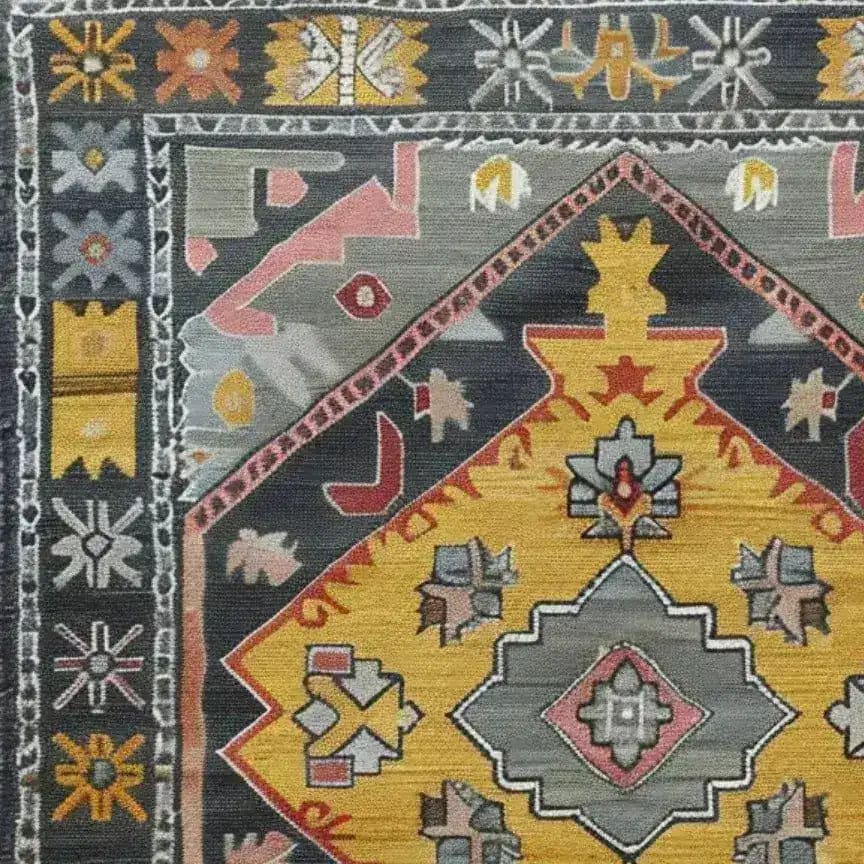 Close-up of the 'Petals in Motion' hand-knotted area rug, showcasing its intricate vintage design with vibrant colors and Persian influences. Perfect for adding a touch of elegance to any living room space.