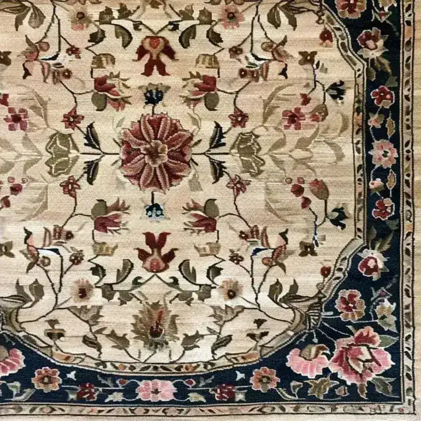 Close-up of the 'Petals in the Breeze Hand Knotted Area Rug', showcasing intricate floral patterns with a classic Persian design. Perfect as a square area rug for dining rooms or bedrooms, this wool rug adds elegance and charm to any space.