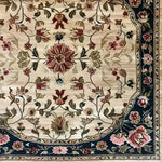 Close-up of the 'Petals in the Breeze Hand Knotted Area Rug', showcasing intricate floral patterns with a classic Persian design. Perfect as a square area rug for dining rooms or bedrooms, this wool rug adds elegance and charm to any space.