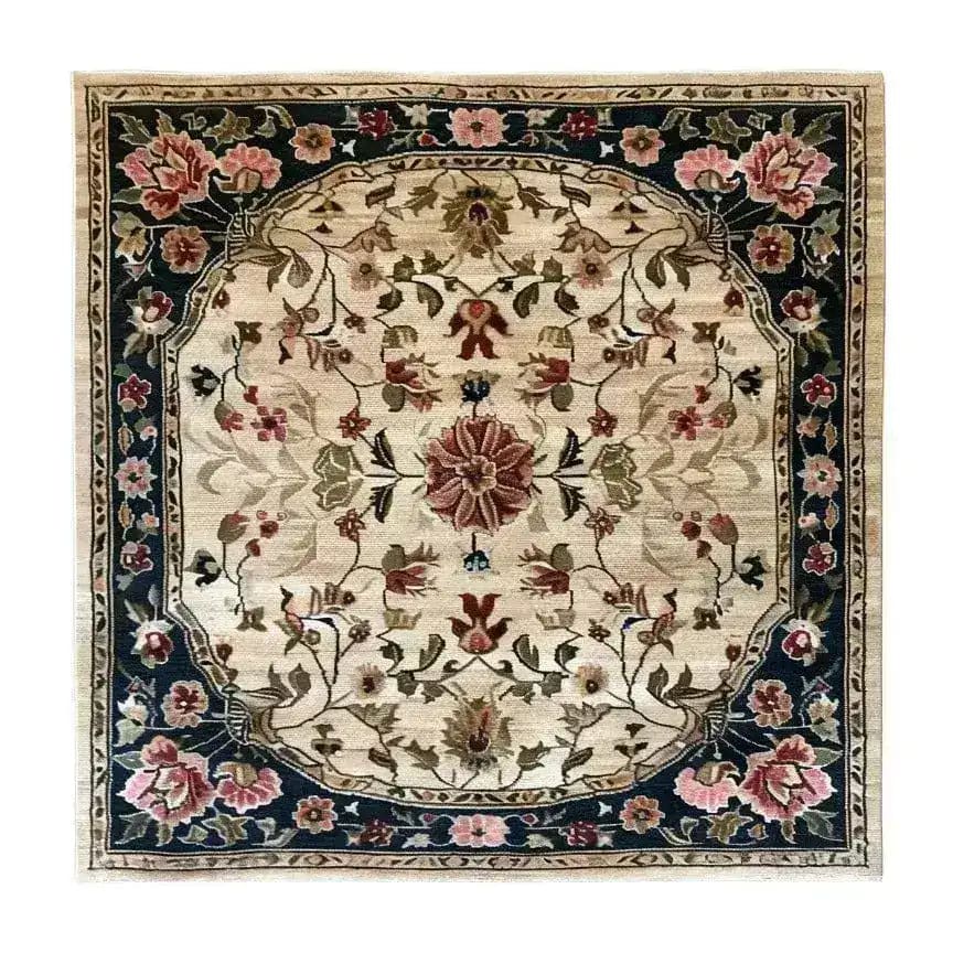 A beautifully detailed, hand-knotted area rug featuring a floral design in earthy tones. This square area rug is perfect for adding elegance to a dining room or bedroom. The intricate Persian-inspired pattern makes it an ideal choice for those seeking a luxurious wool rug to complement their dining table or living space.