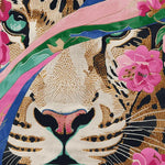 Close-up view of a Petals Meet Predator hand-tufted wool rug featuring an abstract tiger face design with vibrant floral patterns. This square area rug is ideal for large living rooms, combining a unique artistic flair with the practical elegance of a wool rug.
