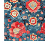 Vibrant Petals of Flame hand tufted area rug featuring a bold floral design. Perfect for adding a splash of color to dining rooms or as an 8x10 living room rug. Made from quality wool, this elegant rug showcases intricate flower patterns on a rich blue background, making it an ideal choice for dining room carpets and floral rug enthusiasts.