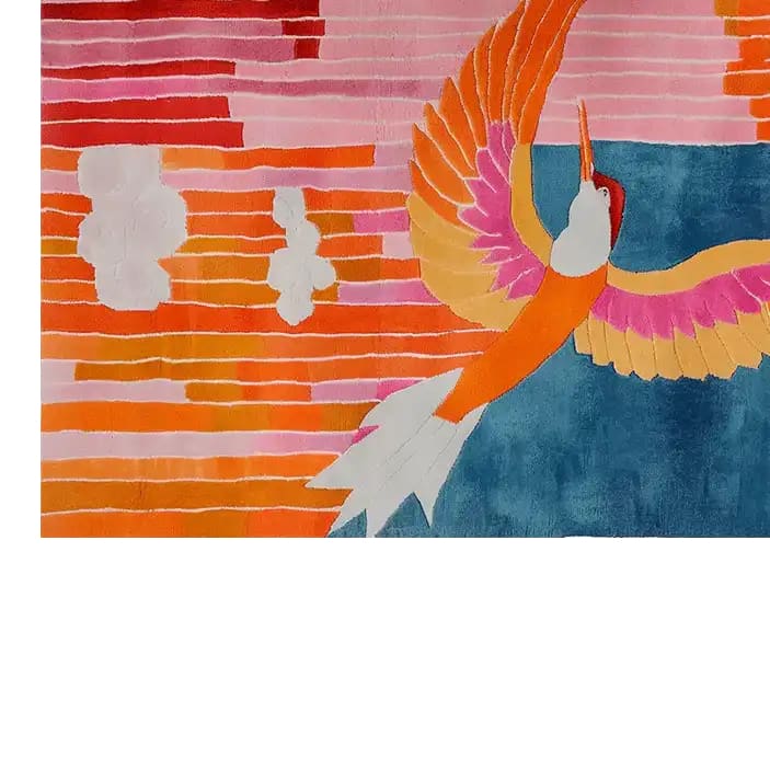 Vibrant Phoenix Flight Hand Tufted Wool Rug featuring a colorful abstract design with a phoenix soaring against a backdrop of warm red and orange stripes. Perfect area rug for adding a touch of art to any living room.