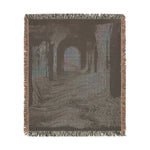 Pink and Black Geometric Woven Blanket dark arched corridor atmospheric interior woven throw square fringe edges