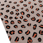 A stylish pink and black leopard print area rug, hand-tufted from wool, perfect for adding a bold touch to any living room or as a chic kitchen runner rug. The abstract animal print design makes it ideal for use as a hallway runner rug, large living room rug, or even a bathroom runner rug. Its vibrant pattern brings a vintage rug feel, making it a standout piece in any setting.