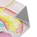 Pink Donut Drip Accent Rug folded corner showing yellow drip print surface and gray non-slip backing detail