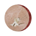 Round area rug featuring a beautiful design of pink flying Japanese cranes, crafted from wool. This hand-tufted rug adds an elegant touch to any bedroom or living room, making it a perfect choice for those seeking large area rugs for a cozy and stylish space.