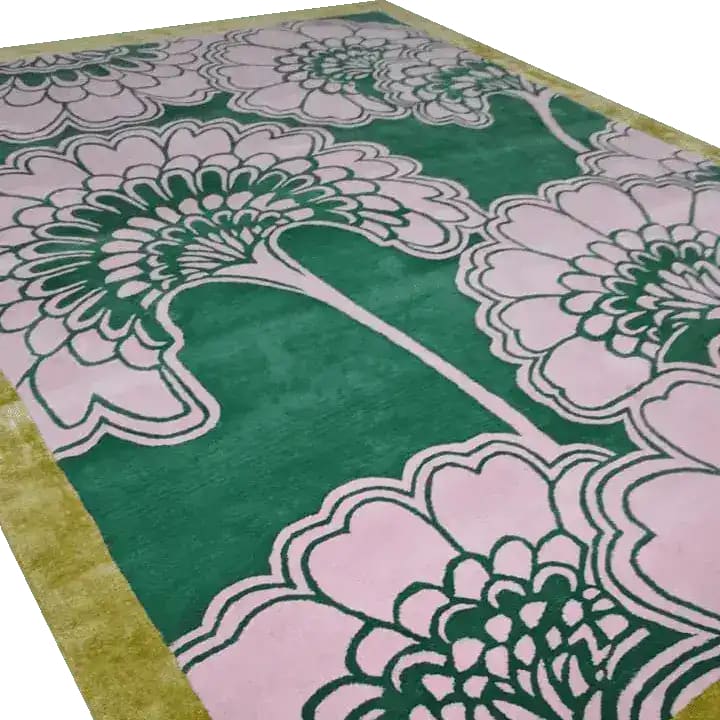 A beautiful hand-tufted wool area rug featuring a striking design of pink gingko leaves on a green background. Perfect for large living rooms, this 8x10 wool rug adds elegance and warmth to any space.