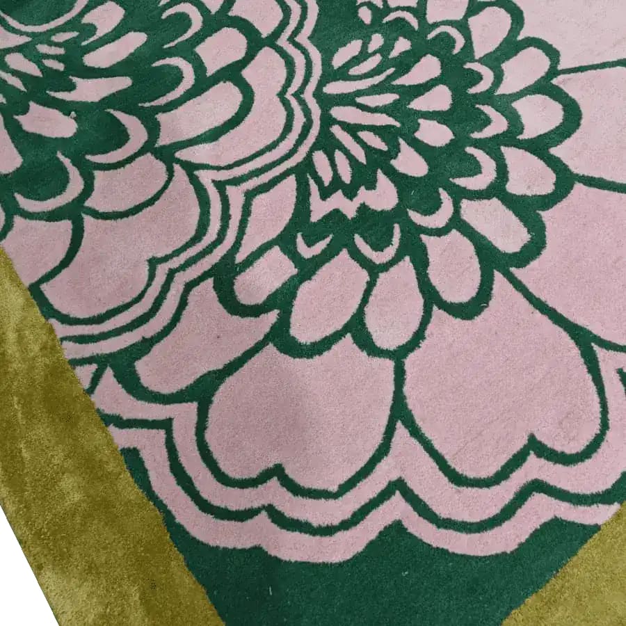 Close-up view of a Pink Ginkgo Leaves Hand Tufted Wool Rug, featuring intricate green floral patterns on a soft pink background, perfect for large living rooms. This area rug, measuring 8x10, adds elegance and style to any living room space.