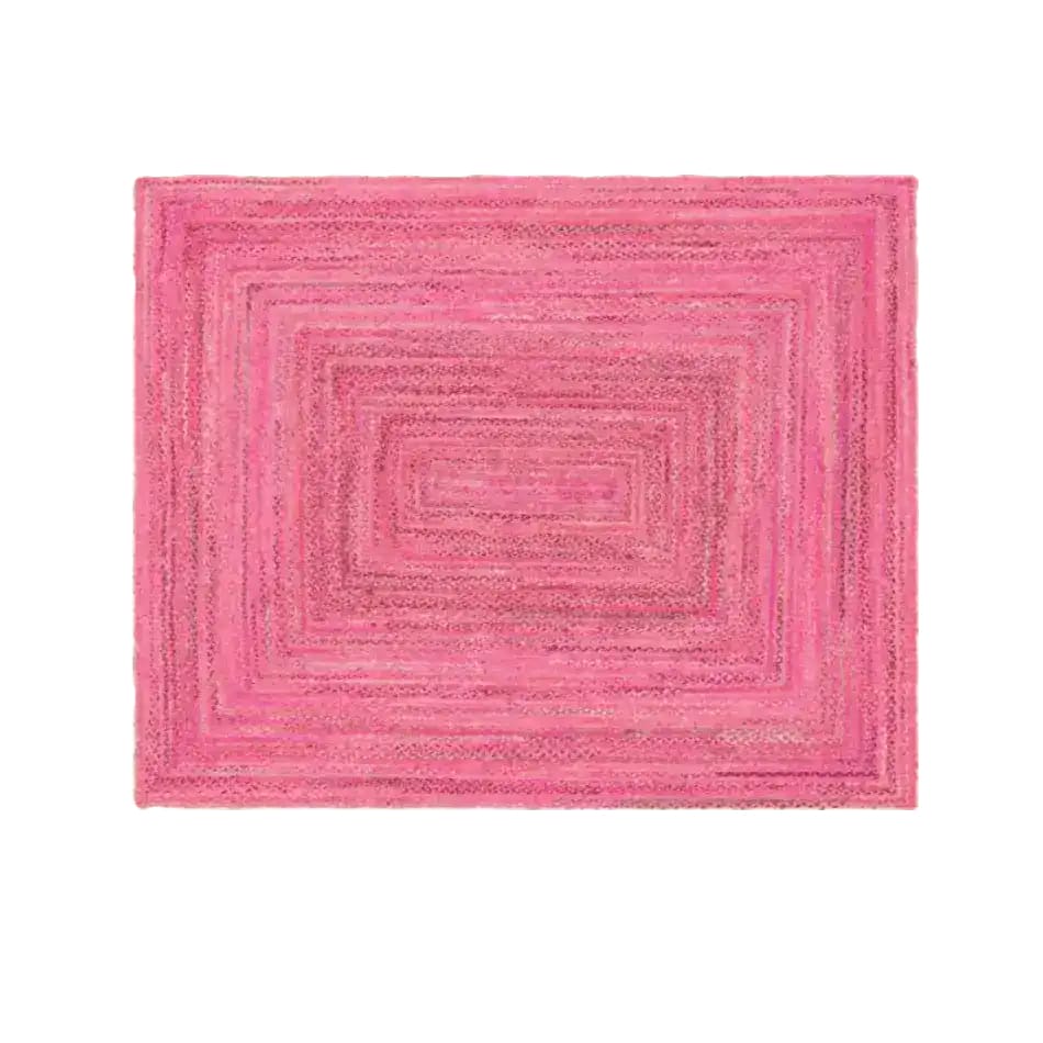 A vibrant pink hand-braided jute area rug, perfect for adding a pop of color to your living room. This large 8x10 rug is ideal for those seeking stylish and eco-friendly living room rugs.
