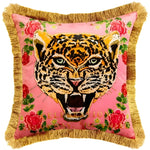 Pink leopard face throw pillow with gold fringe and floral accents, perfect for adding a bold touch to home decor.