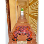 A vibrant Pink Leopard Yogi Accent Wool Rug in a hallway, showcasing its unique leopard design. This large area rug is perfect for adding a bold touch to living rooms, with its striking colors and vintage appeal. Ideal for those seeking living room rugs 8x10 and wool rugs with personality and style.