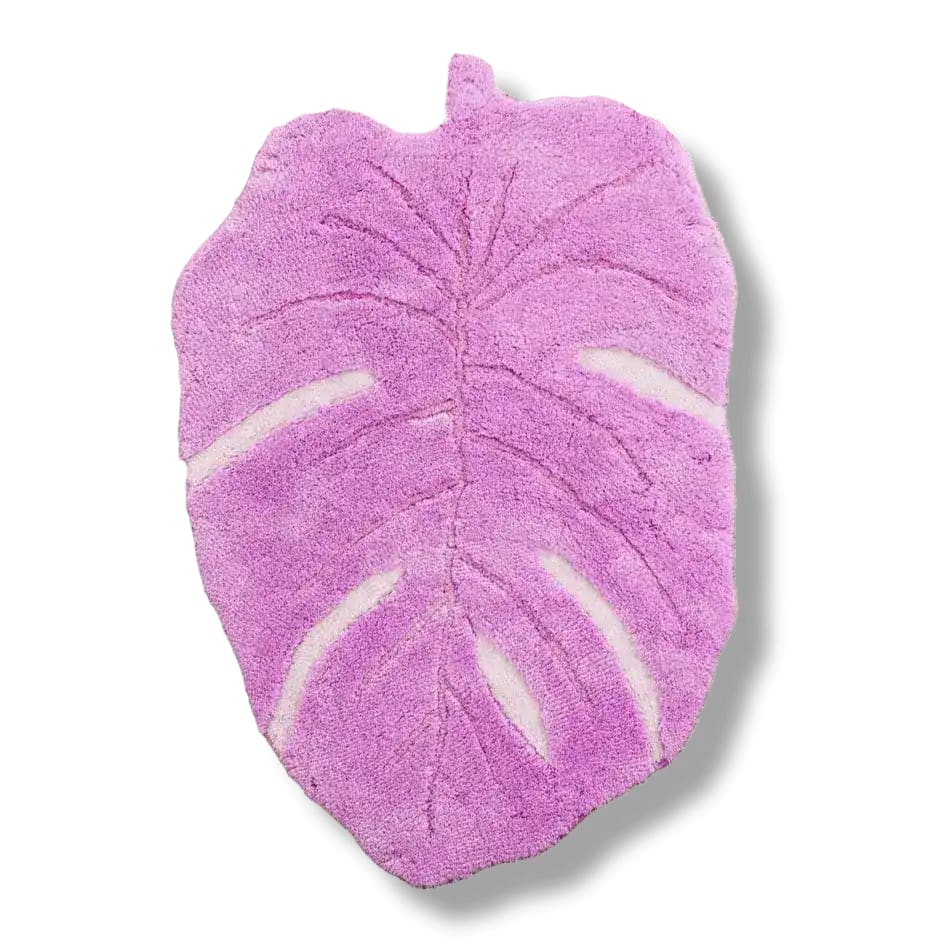 A vibrant pink Monstera leaf shaped area rug crafted from hand-tufted wool, perfect for adding a playful touch to your living room. This unique wool rug stands out as a statement piece, ideal for living room rugs 8x10.